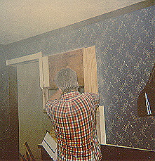 Monty Wells, hard at work, surrounded by dust as usual as he carefully removes part of the wall between our light and airy dining room and our cave-like kitchen, 1988
